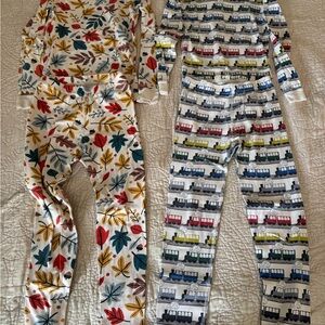 Two Pairs of Hanna Andersson Kids Pajama Sets with Leaves and Train Patterns